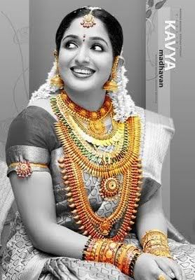 Indian Wedding Hairstyles on South Indian Actress Kavya Madhavan Wearing Bridal Jewellery